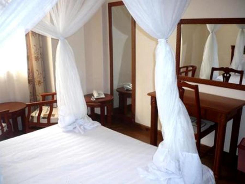Arusha Tourist Inn Hotel Habitación foto